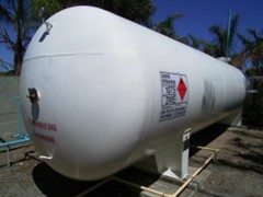 Photo of a white tank which is a gas storage tank compound