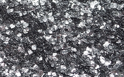 Figure 1 Coarse flake graphite product (>300 µm), Uley Mine. (Photo 415949)