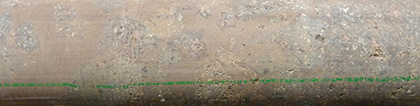 Figure 10(c) Brecciated basalt with hematite-altered siltstone filling the gaps.