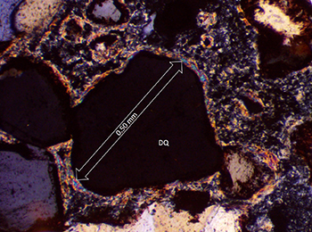 Figure 13 Clay or chlorite mantle on detrital quartz.