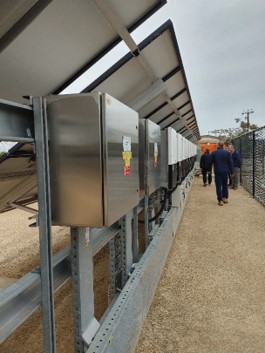 Figure A1 E1: OTR Officers inspect UniSA Mawson Lakes solar equipment with site representatives Photo of OTR Officers inspecting UniSA Mawson Lakes solar equipment with site representatives