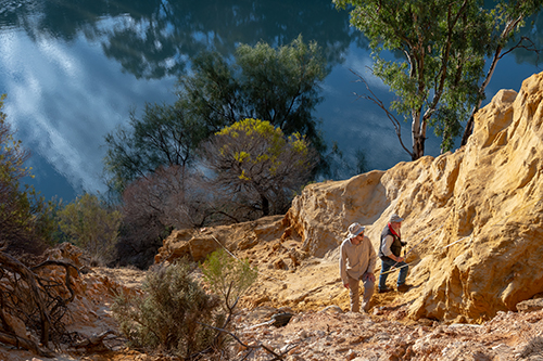 Figure 2 Martin Köhler (left) and John Keeling sampling heavy mineral rich layers within the Loxton Sands.