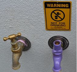 Figure W 9: example of non-drinking water signage Figure W 9: example of a non-drinking water signage. Its a yellow and black sign with 'Warning' at the top and says 'Not for drinking'.
