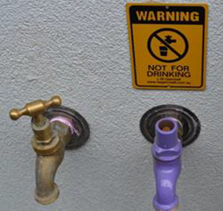 A photo showing taps and an example of non-drinking water signage. 
