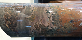Figure 5 Peperitic mixing between basalt (red-brown to green) and grey sediment, MSDP04, 108.1 m. (Photo 416125)