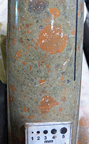 Figure 11a Matrix-supported volcanic breccia with reddish-brown rhyolite clasts, MSDP07, 168 m. (Photo 416278)