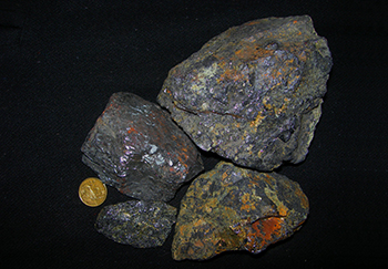 Figure 8 Massive, coarse crystalline magnetite ore with sulfides, Mesoproterozoic iron metasomatite, Cairn Hill. (Photo 409485)